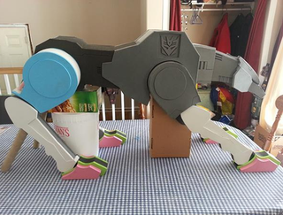 Illustration for article titled A Giant Foam Ravage Is The Ultimate Transformers Kitchen Accessory